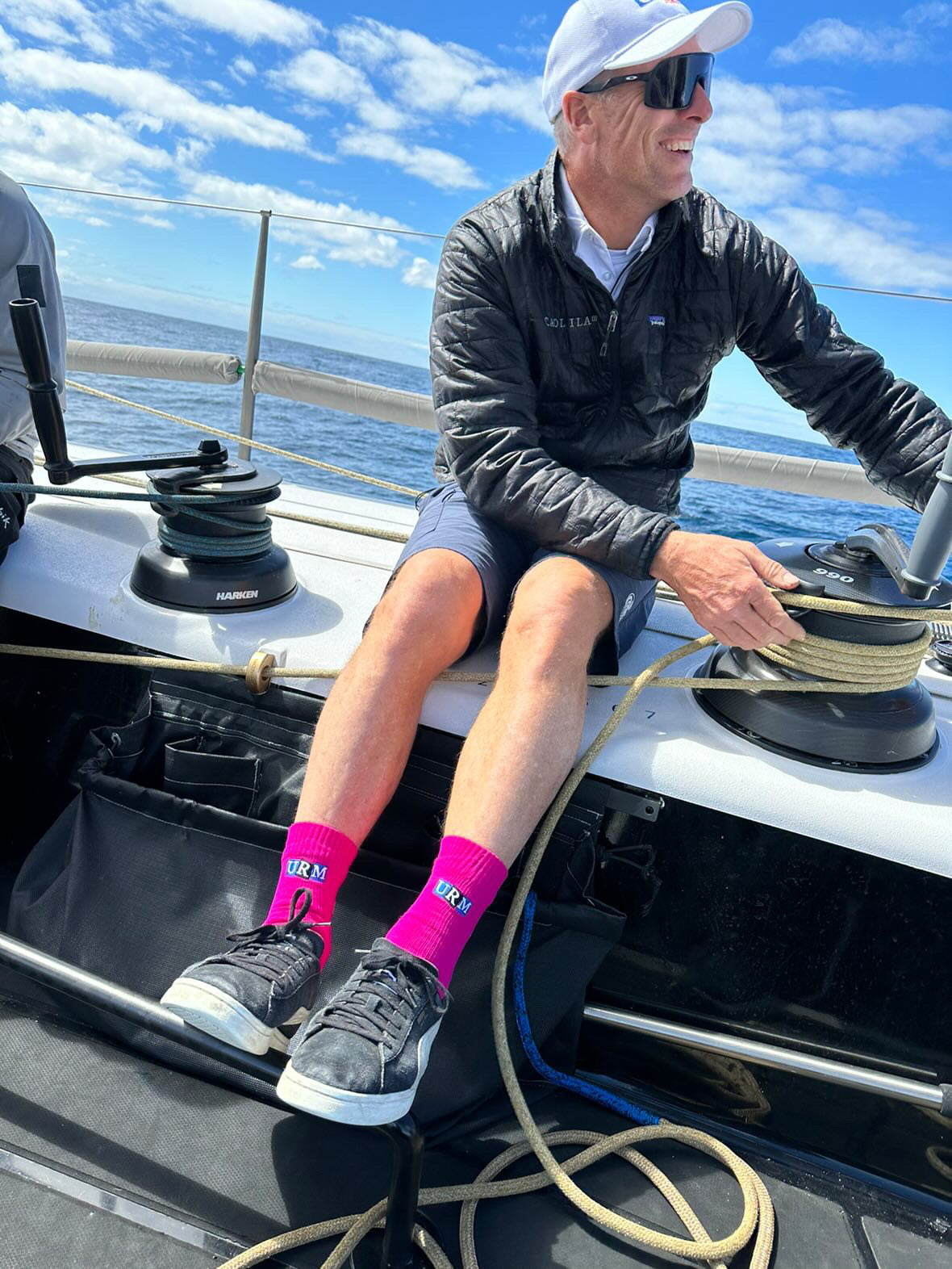 URM GRoup co branding with PInk Dry Socks in partnership with Femme Soleil by Rachel sailing team